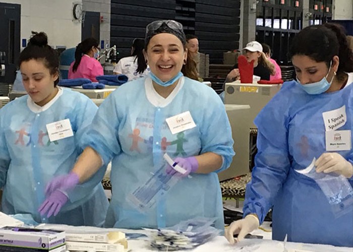 Three dental team members volunteering at community event