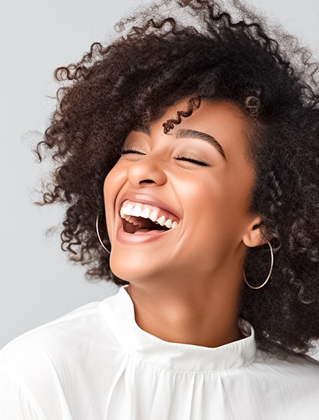 Woman with straight teeth smiling