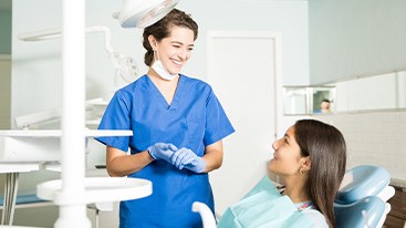 Invisalign patient in Hamden smiling at dentist