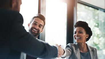 Invisalign patient in Hamden smiling at work
