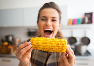 Woman eating corn on the cob