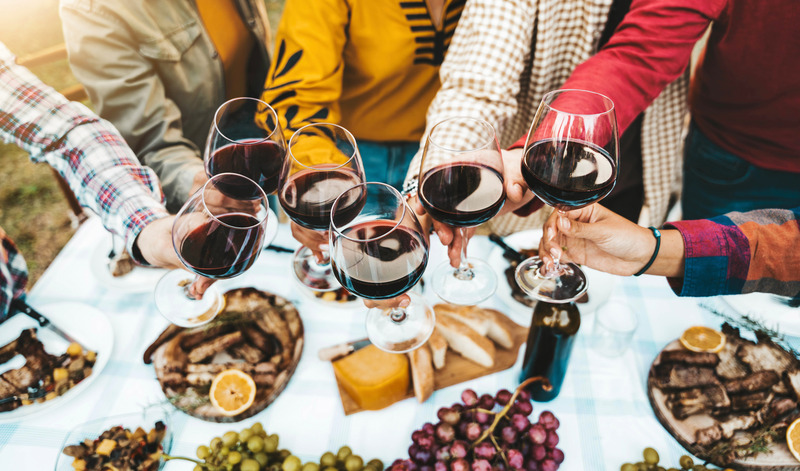 Patient enjoying red wine without tooth stains for the holidays